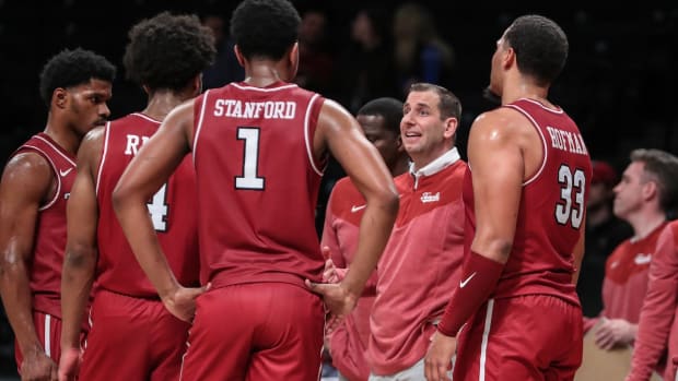 Temple Owls head coach Adam Fisher talks to the team during a timeout in the second half against the Albany Great Danes at Barclays Center in Brooklyn, New York, on Dec. 10, 2023.
